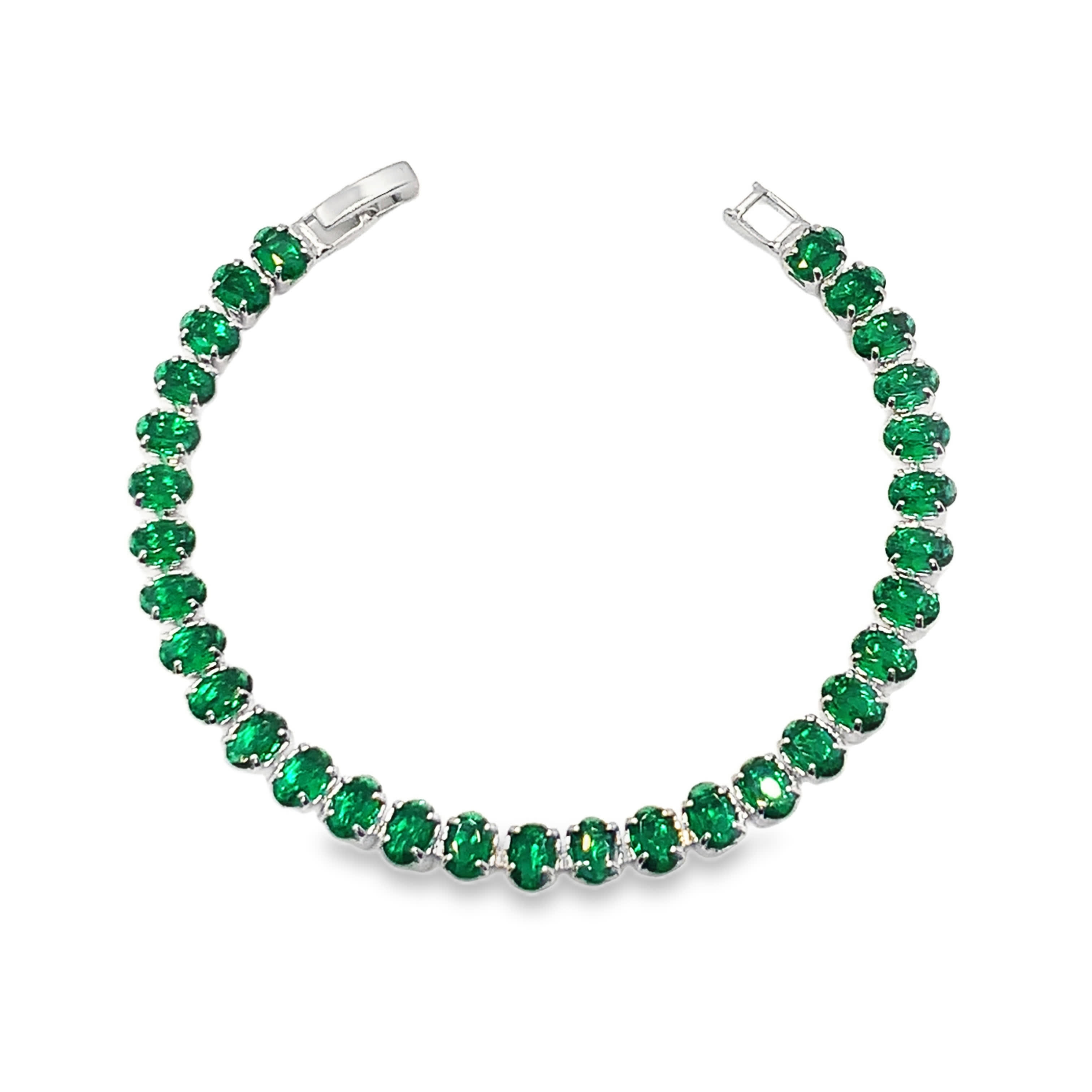 Bransoletka tenisowa ze srebra platerowanego białym złotem i owalnymi szmaragdami