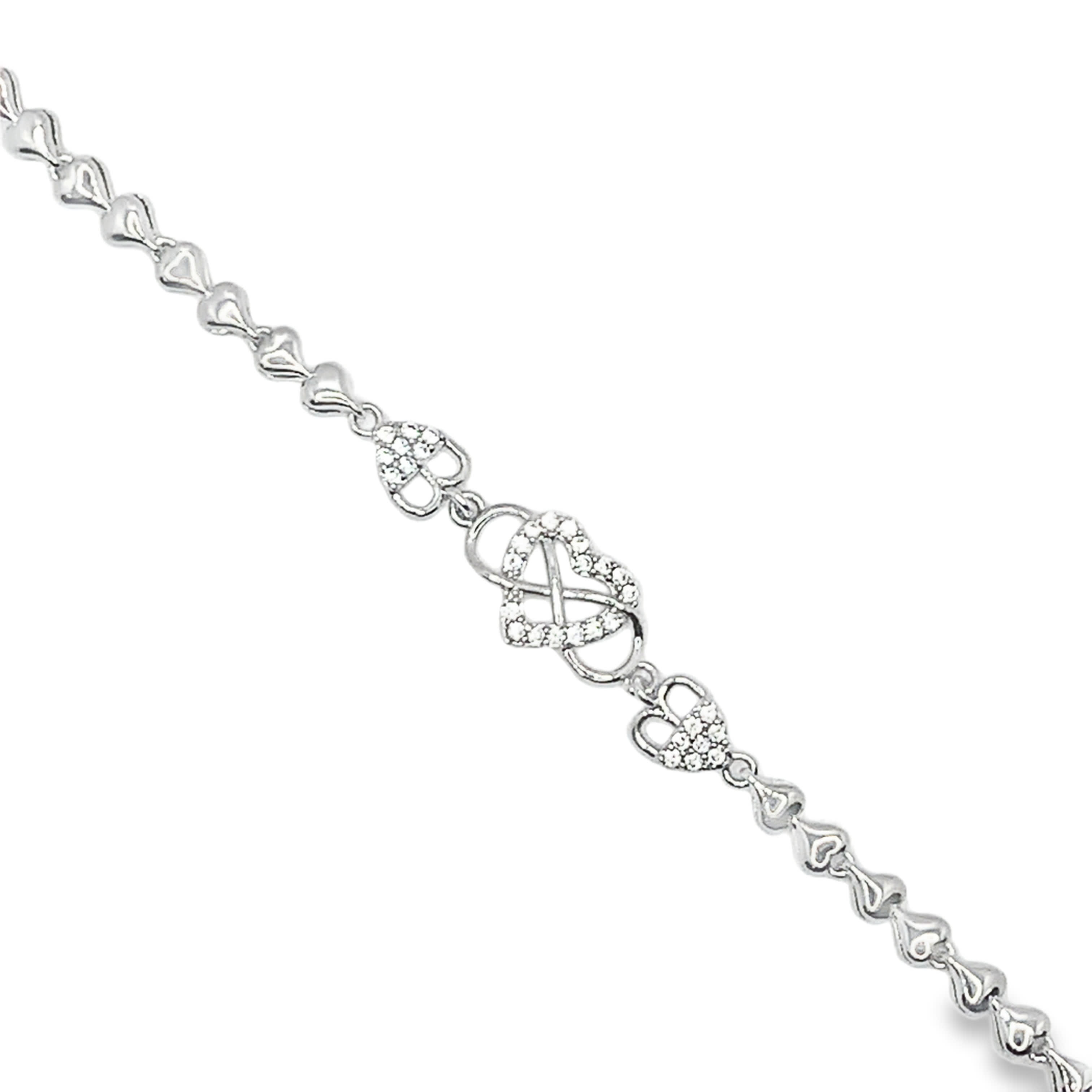 Bransoletka z białego złota na srebrnym łańcuszku w kształcie serca z diamentami