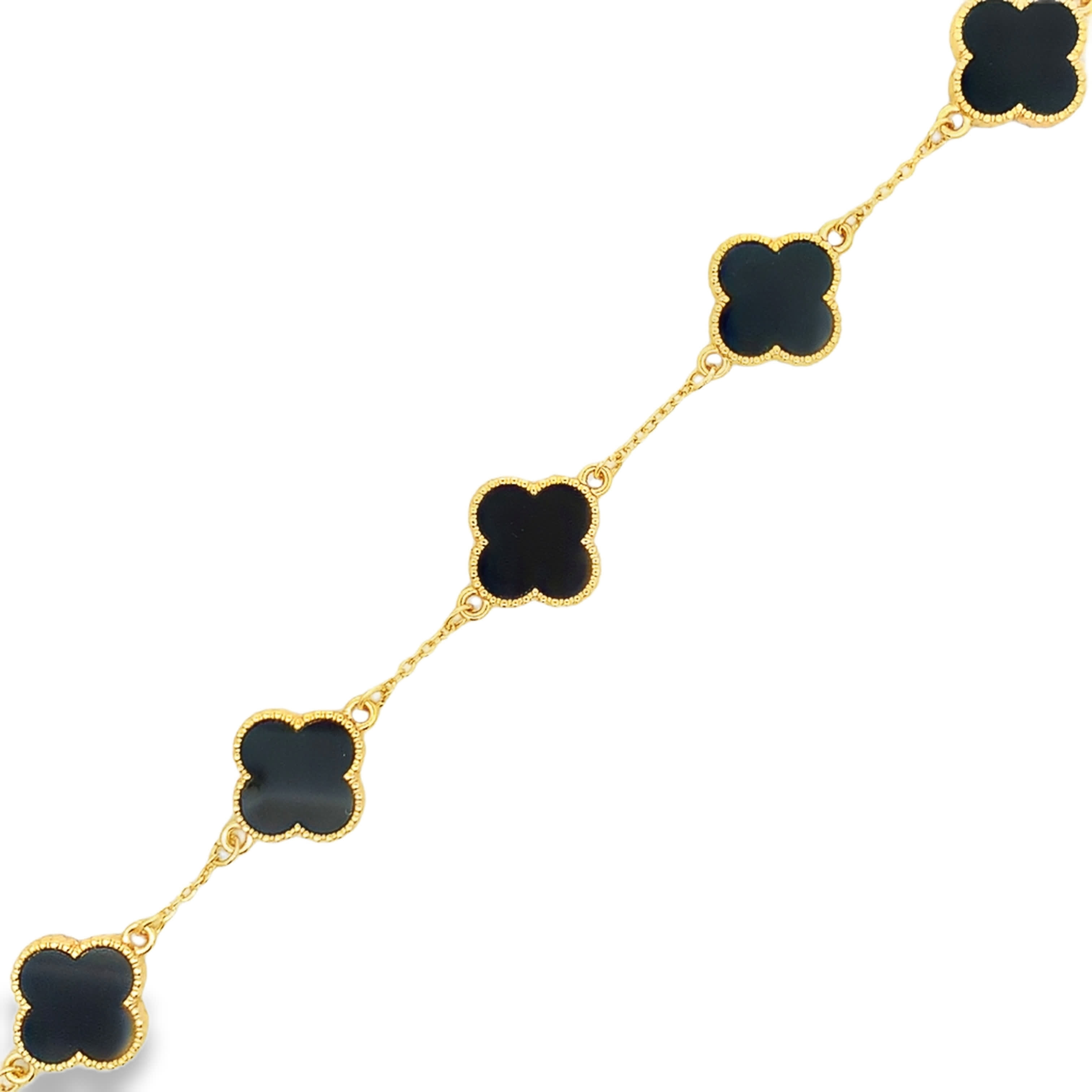 Bransoletka łańcuszkowa z pozłacanego metalu z akcentami onyksu