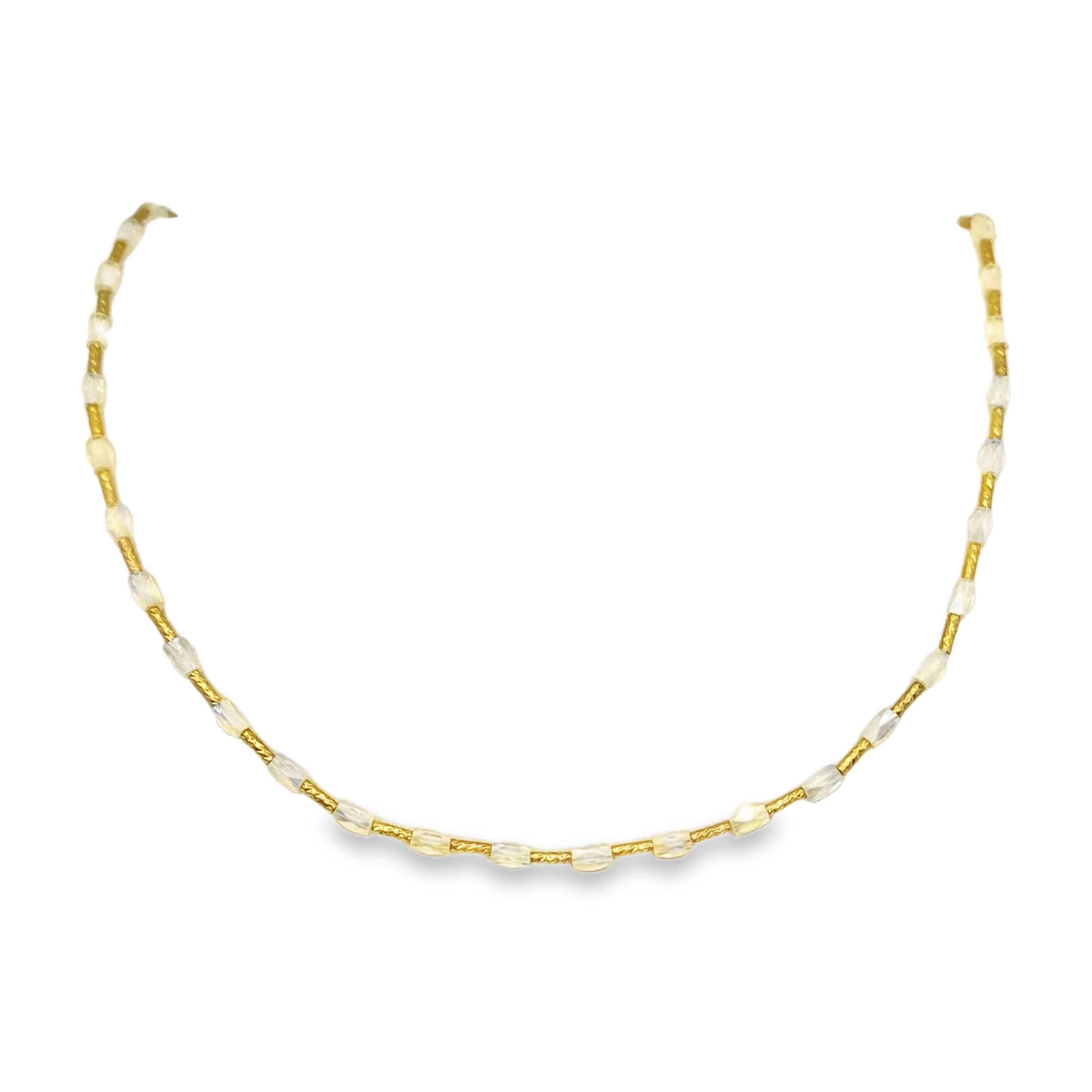 Elegancki naszyjnik z kryształów i żółtego metalu z koralikami