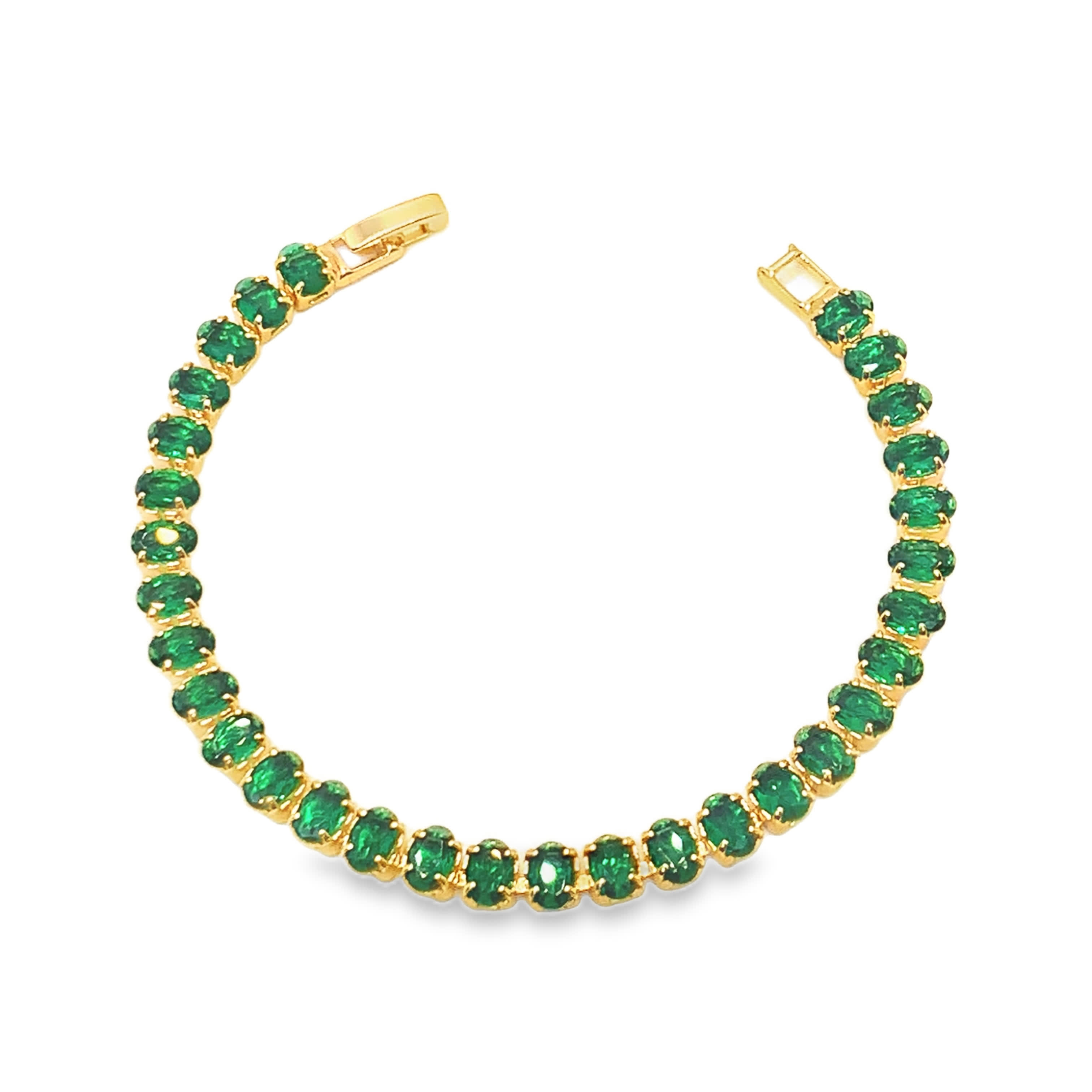 Bransoletka tenisowa z żółtego złota z owalnymi kaboszonami szmaragdowymi