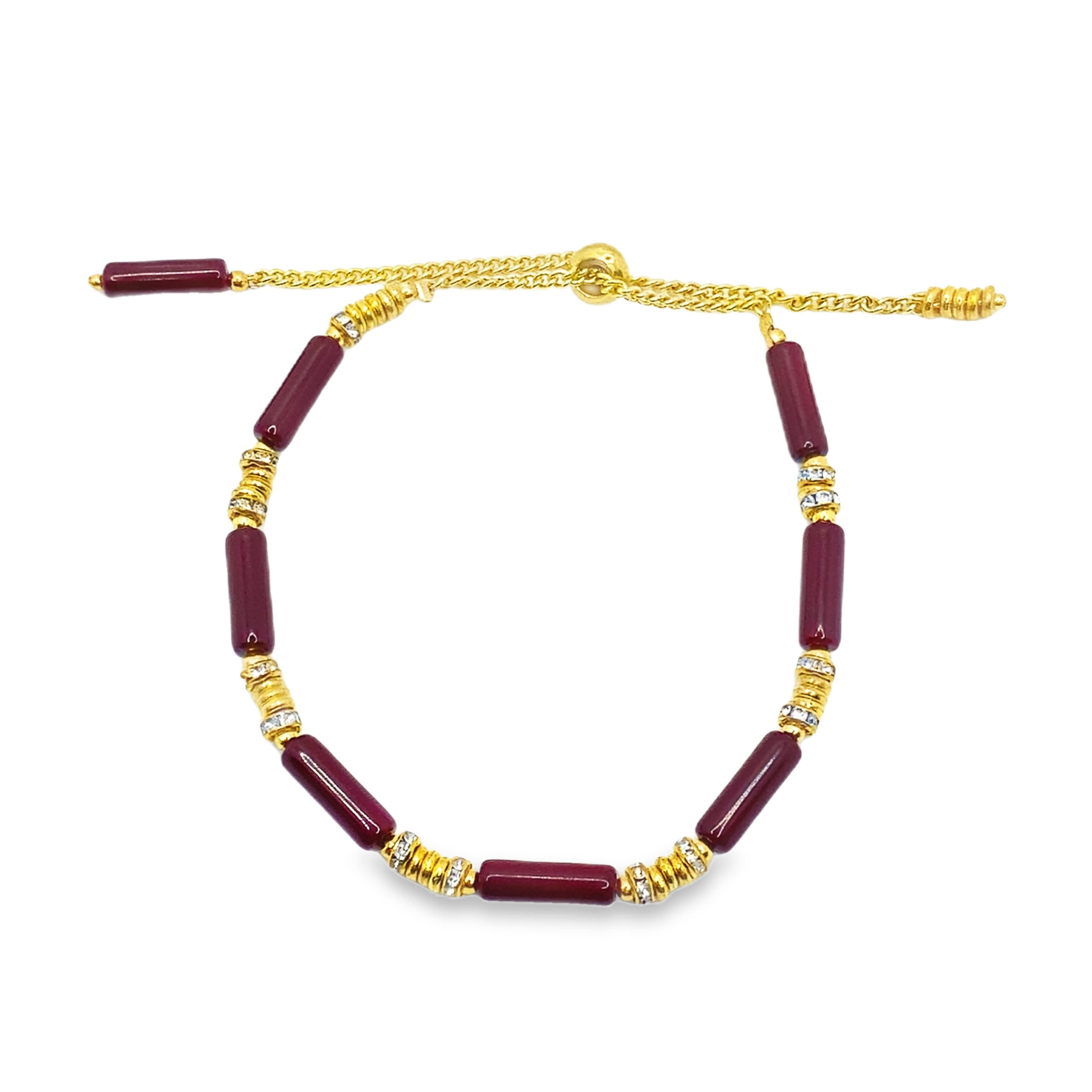 Bransoletka z bordowych koralików z akcentami z żółtego złota