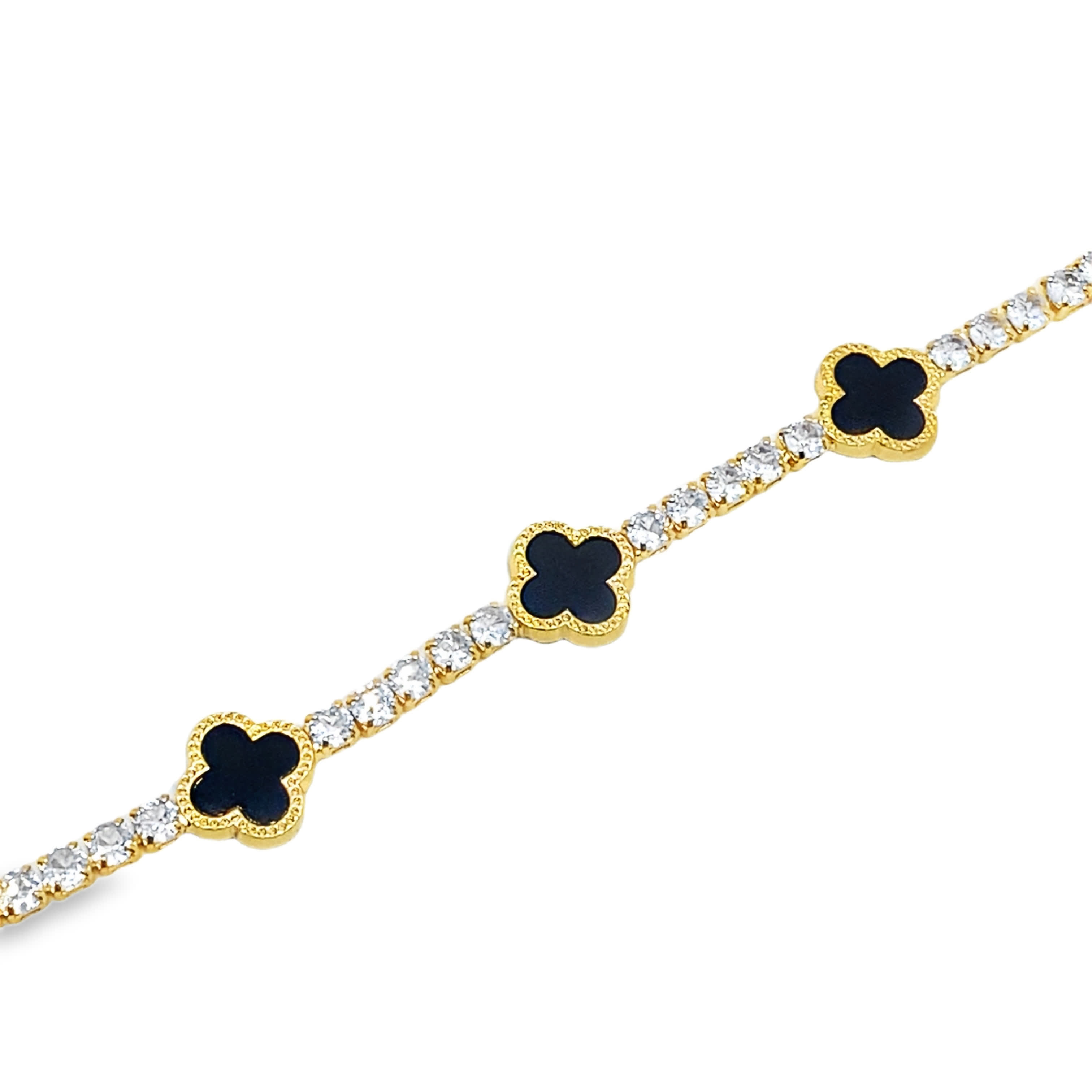 Bransoletka tenisowa w kolorze żółtego złota z diamentami i akcentami koniczyny